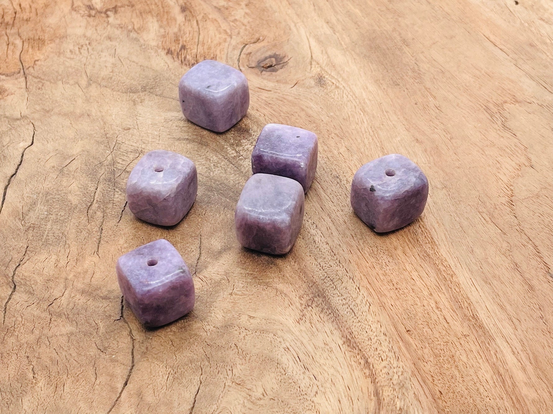 Handmade Lepidolite crystal incense holder with carved design, showcasing a natural stone with purple and pink hues for incense sticks.