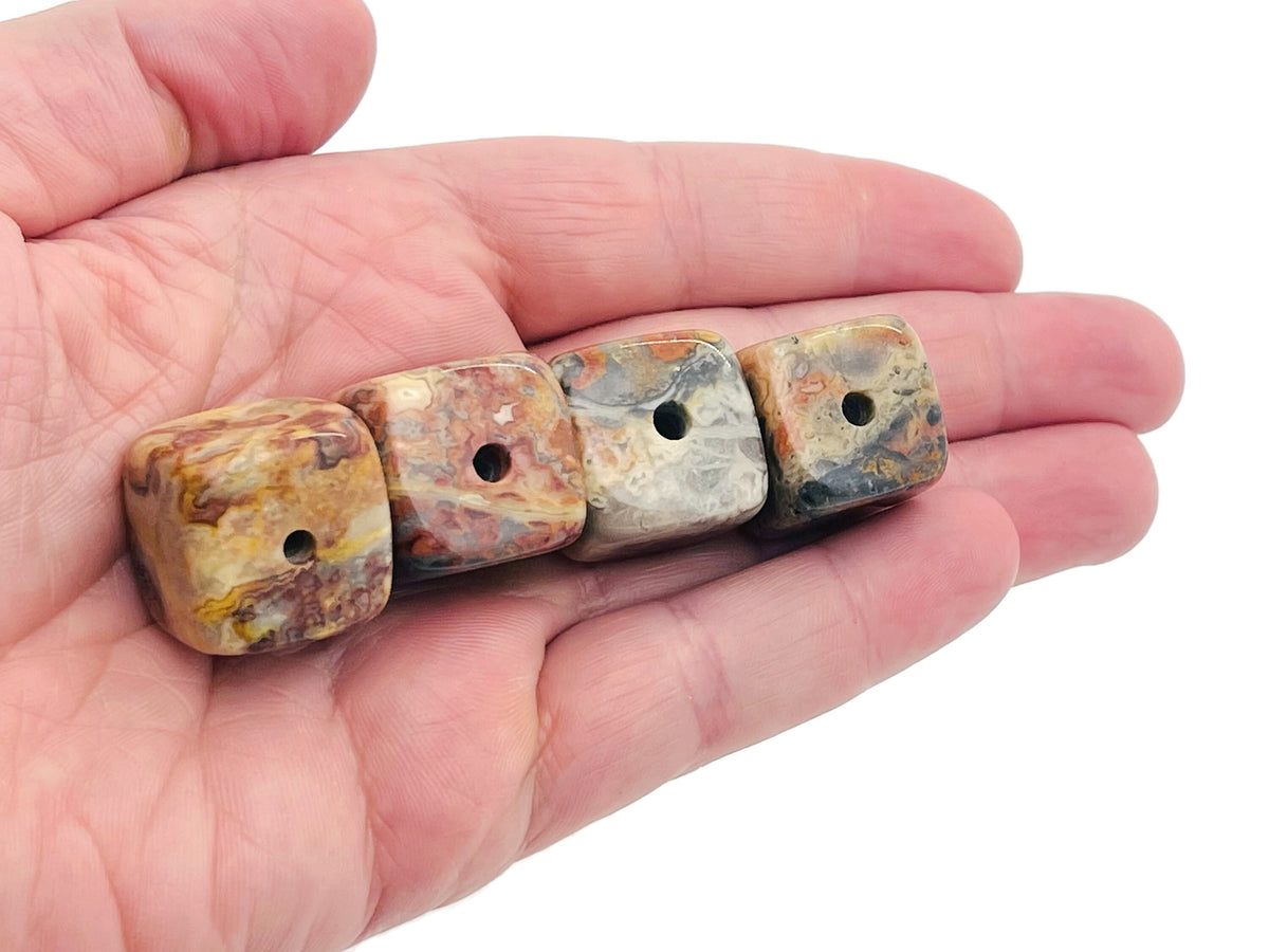 Handmade Crazy Lace Agate crystal incense holder with carved design, featuring vibrant stone patterns for incense stick placement.