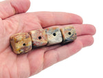 Handmade Crazy Lace Agate crystal incense holder with carved design, featuring vibrant stone patterns for incense stick placement.