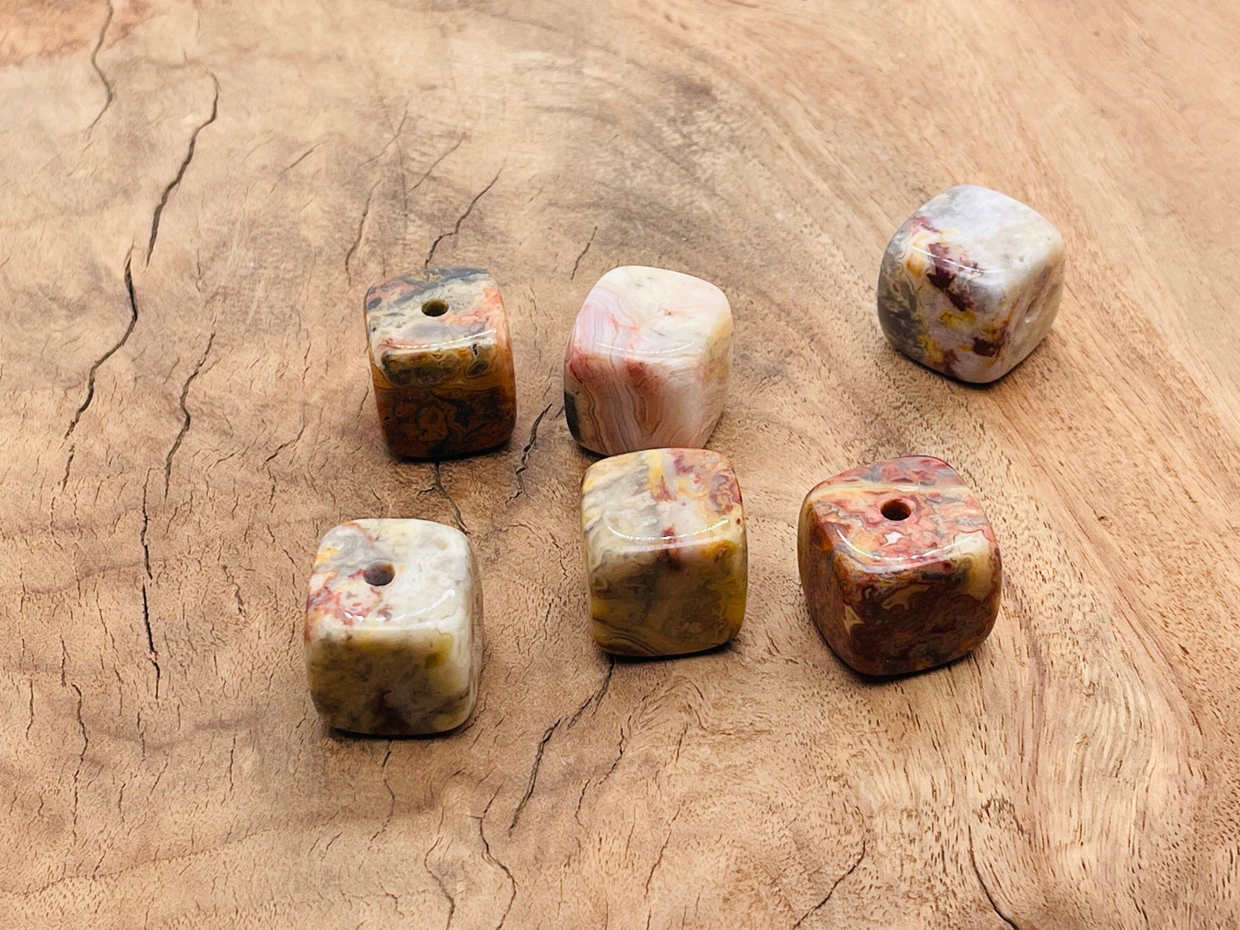 Handmade Crazy Lace Agate crystal incense holder with carved design, perfect for holding incense sticks and enhancing spiritual spaces.