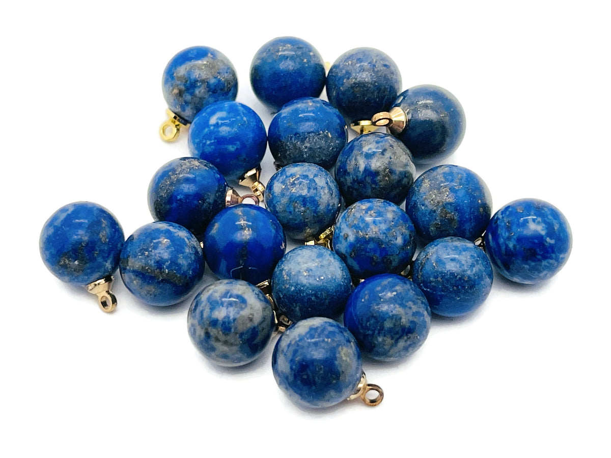 Lapis lazuli ball beads with crystal pendant jewelry featuring deep blue gemstone and gold accents, crafted by GemstoneGO.