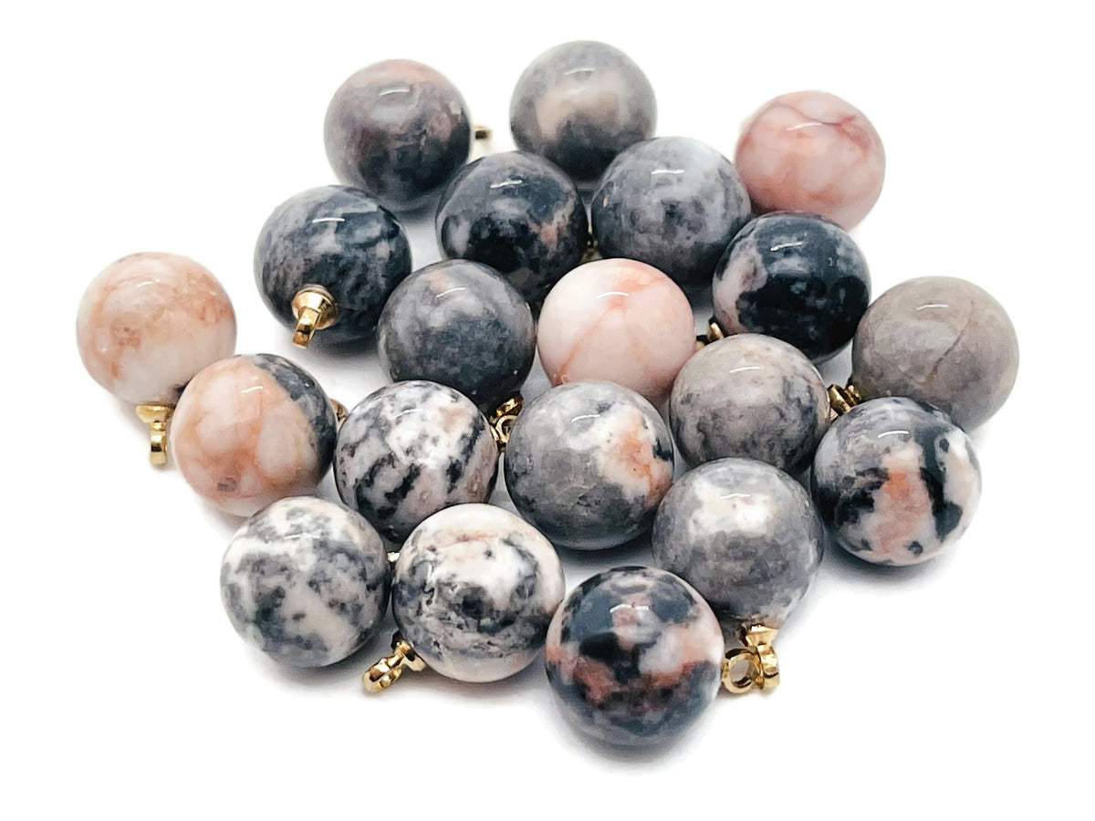 Pink Zebra Calcite ball beads crystal pendant featuring vibrant pink and white hues, handcrafted jewelry stone from GemstoneGO.