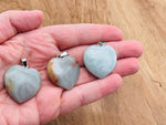 Amazonite heart crystal pendant from GemstoneGO, featuring a natural Reiki healing gemstone with detailed craftsmanship.