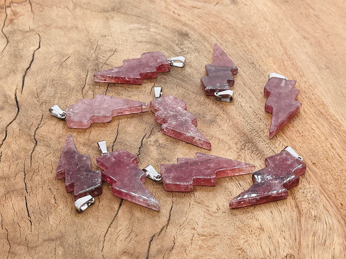 Strawberry Quartz Lightning Crystal Pendant featuring a vibrant pink gemstone and lightning-shaped silver setting from GemstoneGO.