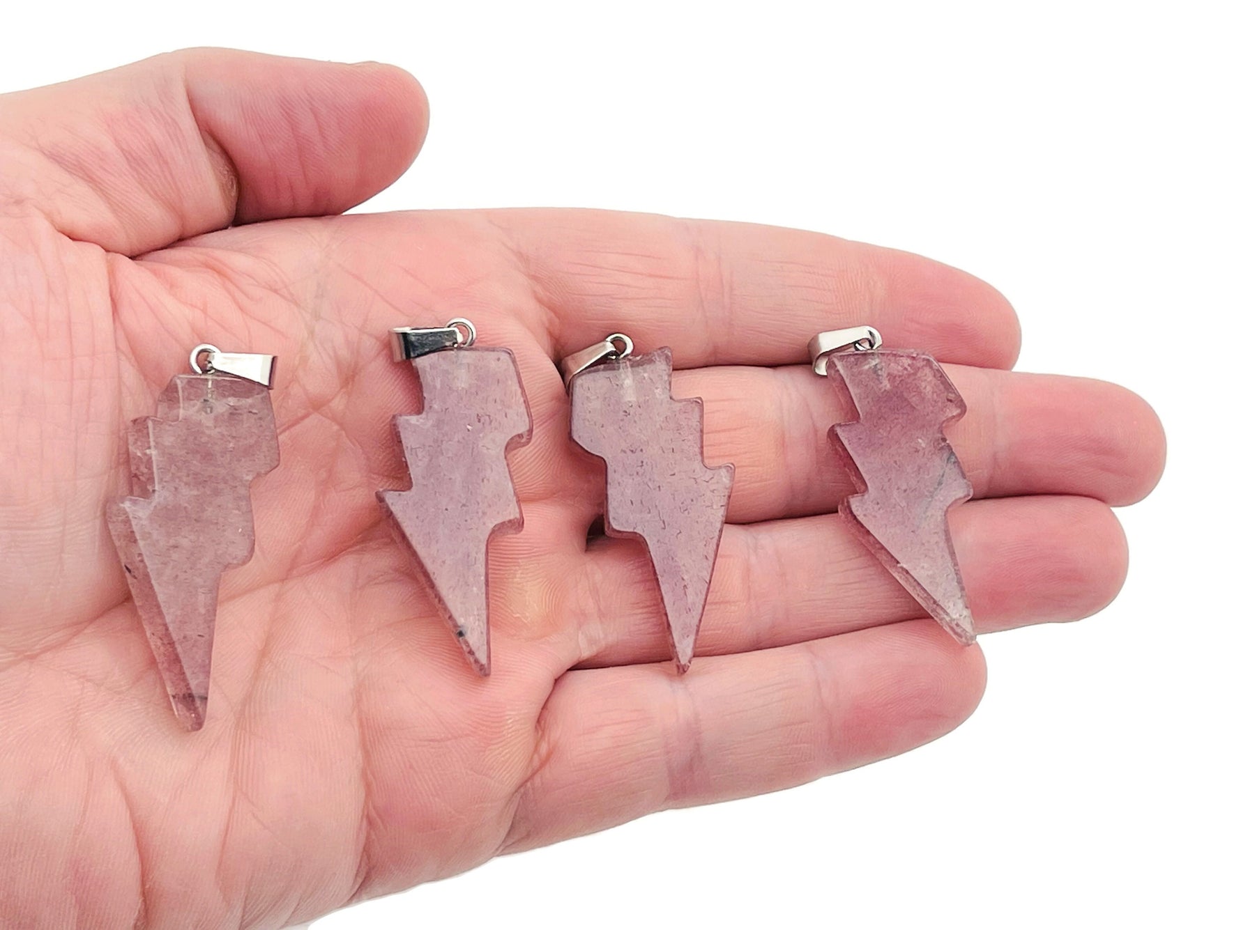 Strawberry Quartz Lightning Crystal Pendant from GemstoneGO featuring a vibrant pink quartz stone with lightning bolt design.