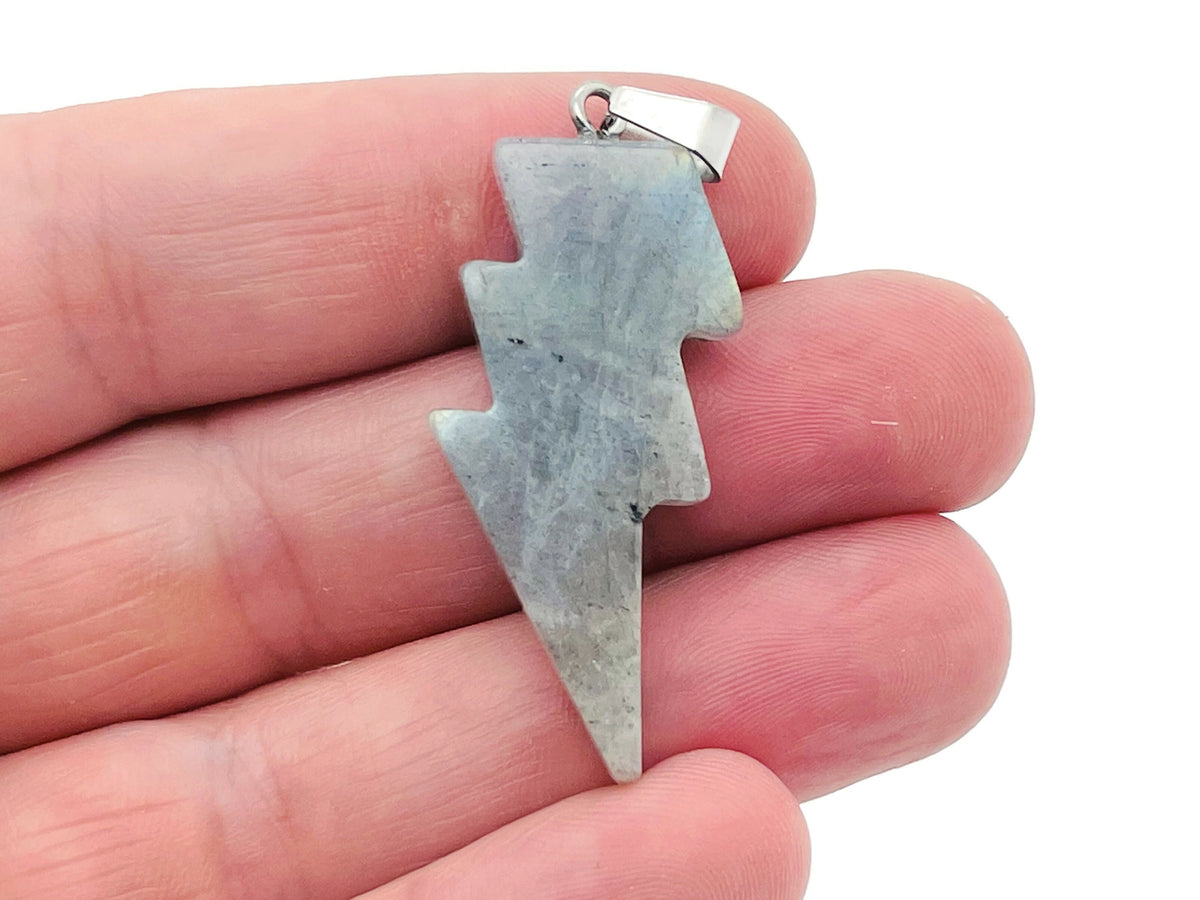 Labradorite Lightning Crystal pendant with vibrant flash, featuring a polished lightning stone set in a silver-toned metal, on a chain.