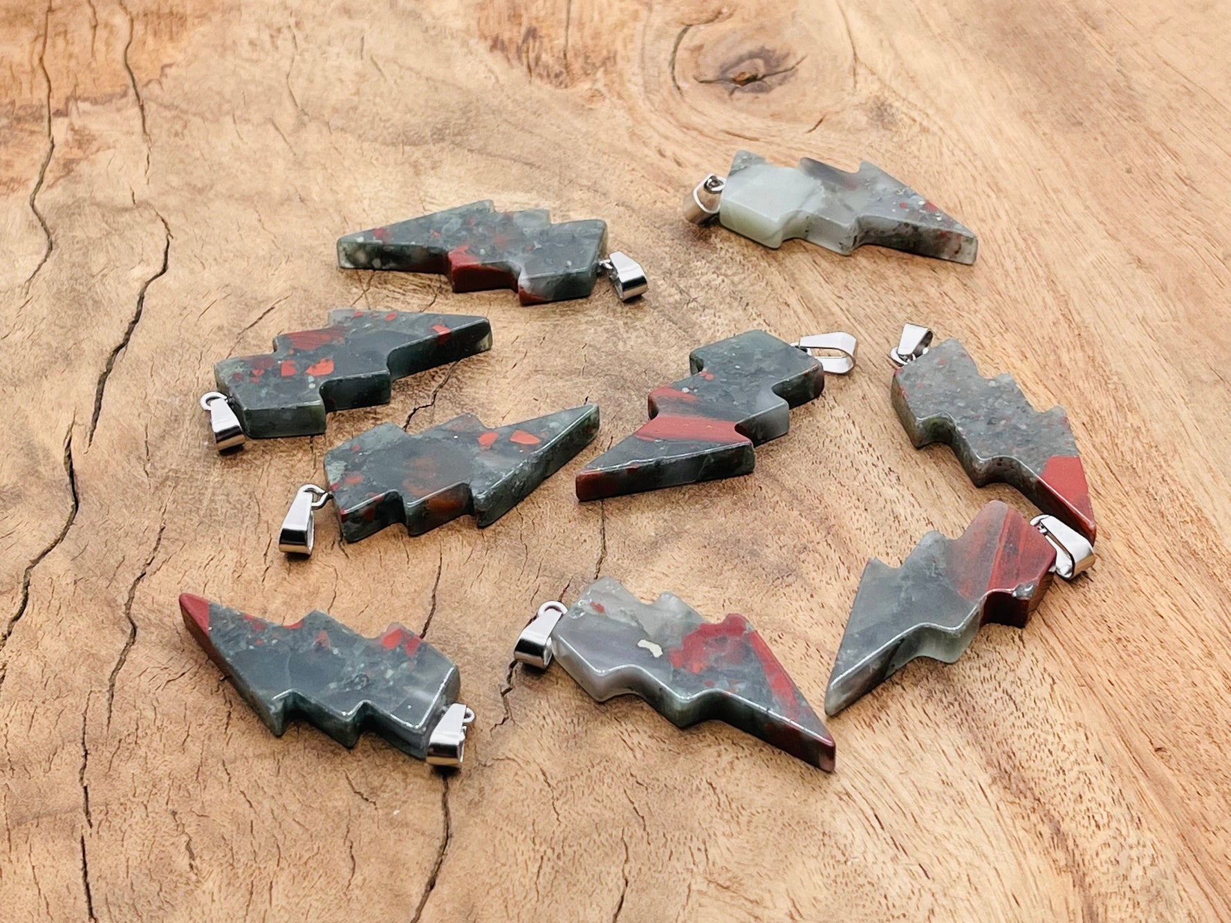 African Bloodstone Lightning Crystal pendant featuring a striking lightning stone gemstone on a silver chain.