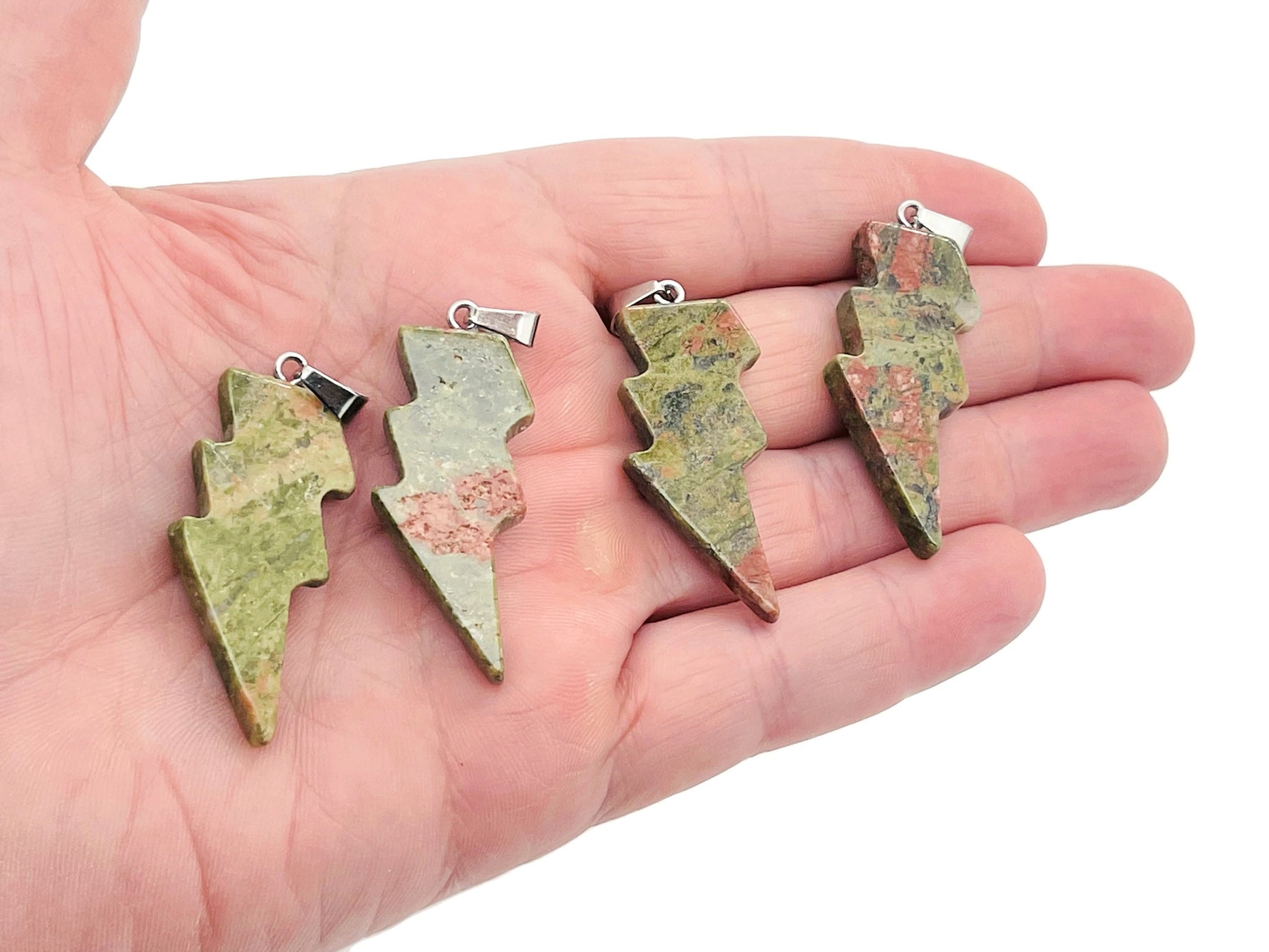 Unakite lightning crystal pendant from GemstoneGO featuring a vibrant orange and green lightning stone gemstone necklace.