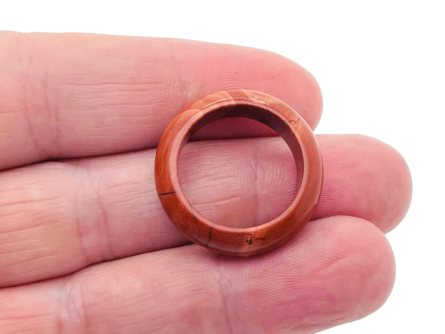 Red Jasper crystal ring by GemstoneGO featuring a polished red Jasper gemstone set in a silver band.