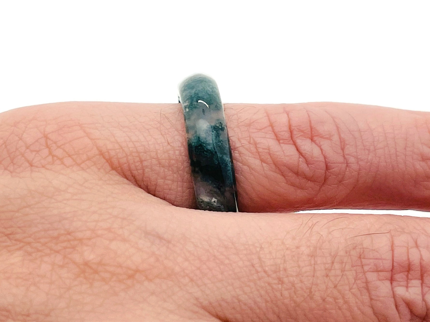 Moss Agate crystal ring by GemstoneGO featuring a polished moss green gemstone set in a silver band.