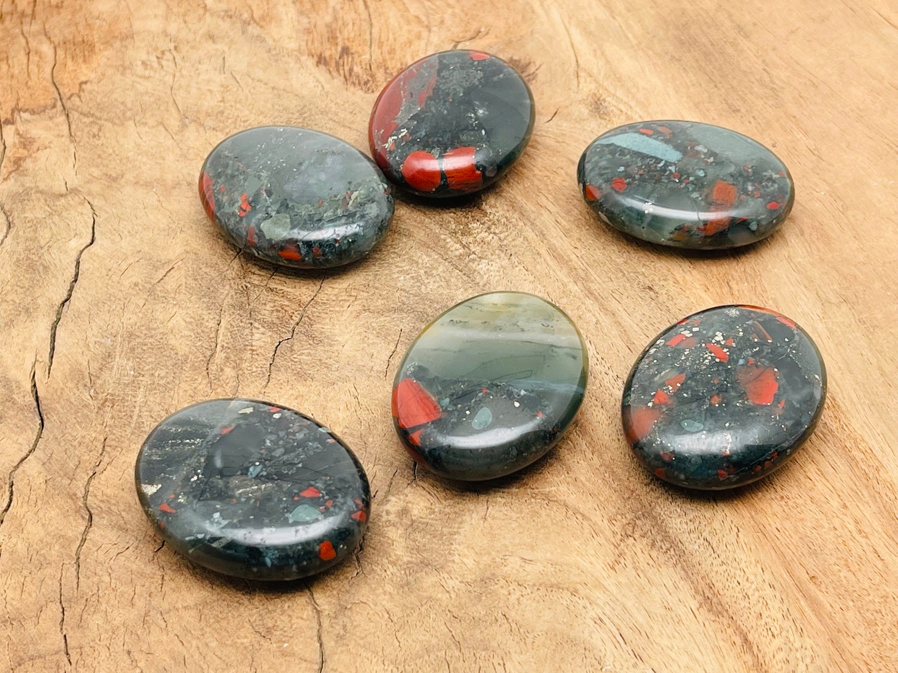 African Bloodstone palm gemstone spa stone, 45x35mm, smooth polished bloodstone with natural deep green and red mineral patterns.