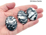 Oval palm gemstone spa stone in mixed crystals, 45x35mm, from GemstoneGO, showing smooth, polished surface for relaxation and massage.