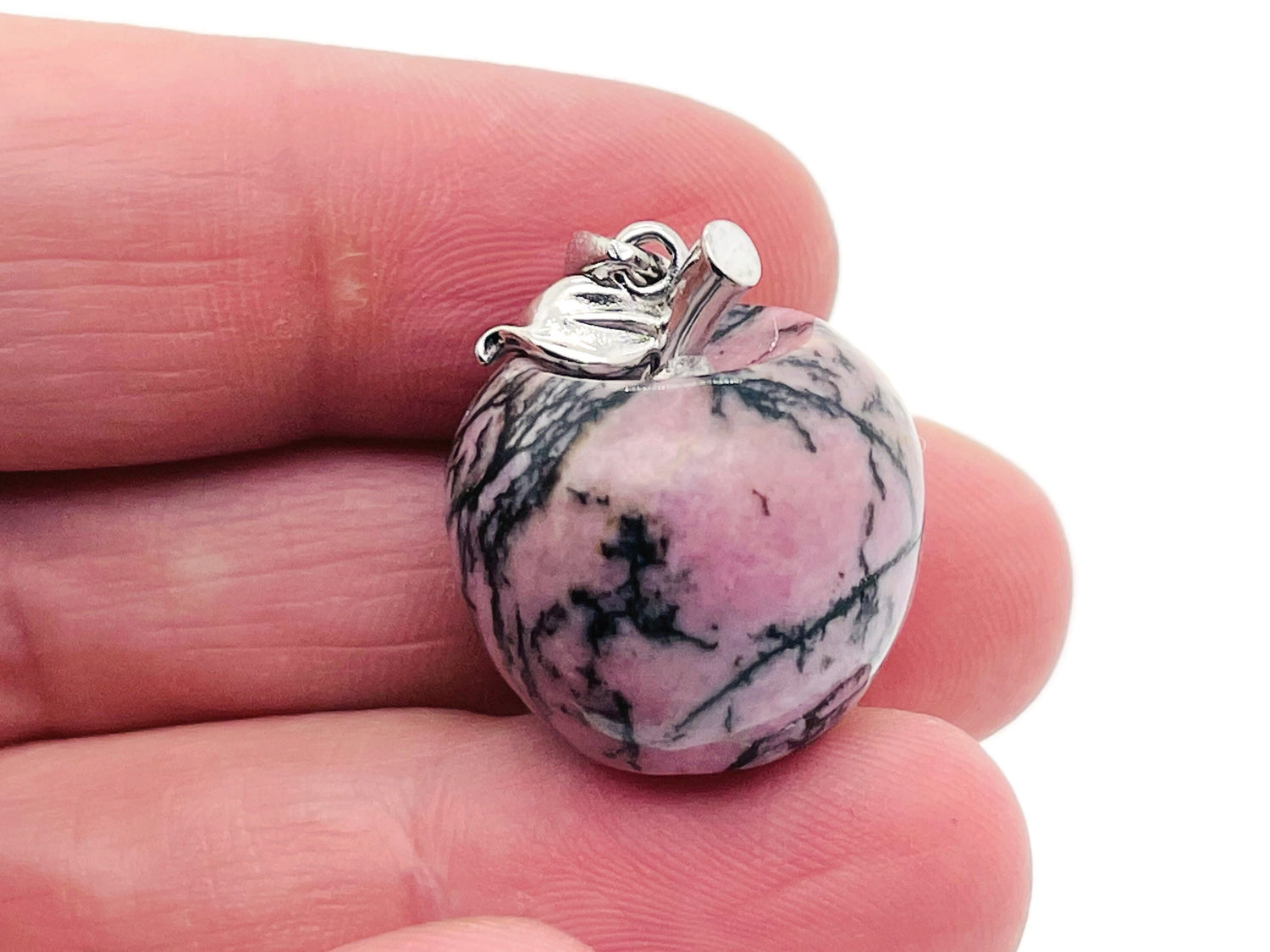 Rhodonite apple-shaped crystal pendant from GemstoneGO featuring a mini gemstone pendant with vibrant pink and black hues.