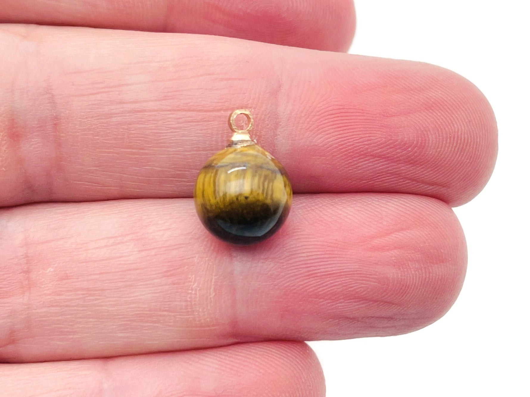 Tiger Eye ball beads crystal pendant from GemstoneGO featuring polished tiger eye stone jewelry component.