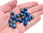 Lapis Lazuli ball beads with crystal pendant, showcasing deep blue stones with gold flecks, jewelry stone by GemstoneGO.