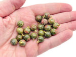 Unakite ball beads crystal pendant from GemstoneGO, showcasing polished green and pink gemstone jewelry stone for necklaces.