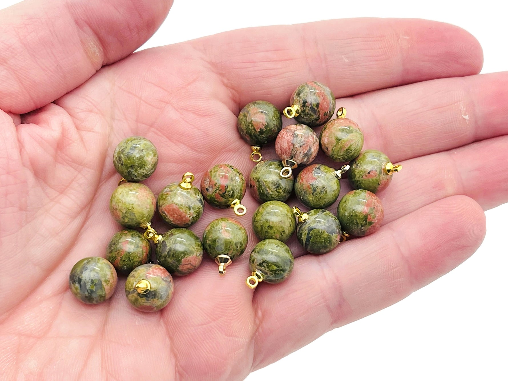 Unakite ball beads crystal pendant from GemstoneGO, showcasing polished green and pink gemstone jewelry stone for necklaces.