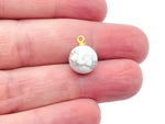 Howlite ball beads with crystal pendant, jewelry stone from GemstoneGO, showcasing smooth white and gray marbled gemstone beads.