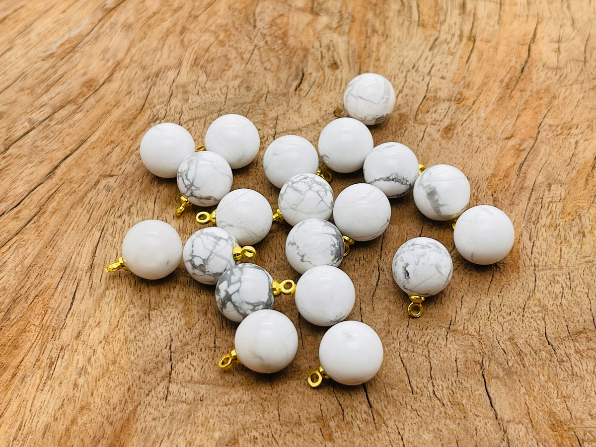 Howlite ball beads with crystal pendant, jewelry stone accessory featuring polished white Howlite and a sparkling crystal accent.