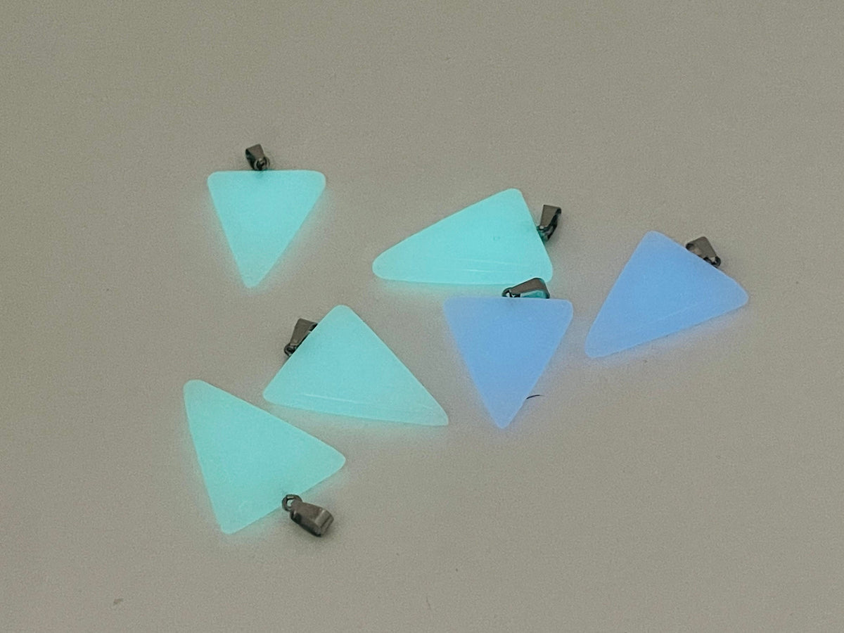 Luminous triangle crystal pendant with healing stone, featuring a glowing gemstone set in a silver-tone metal, by GemstoneGO.