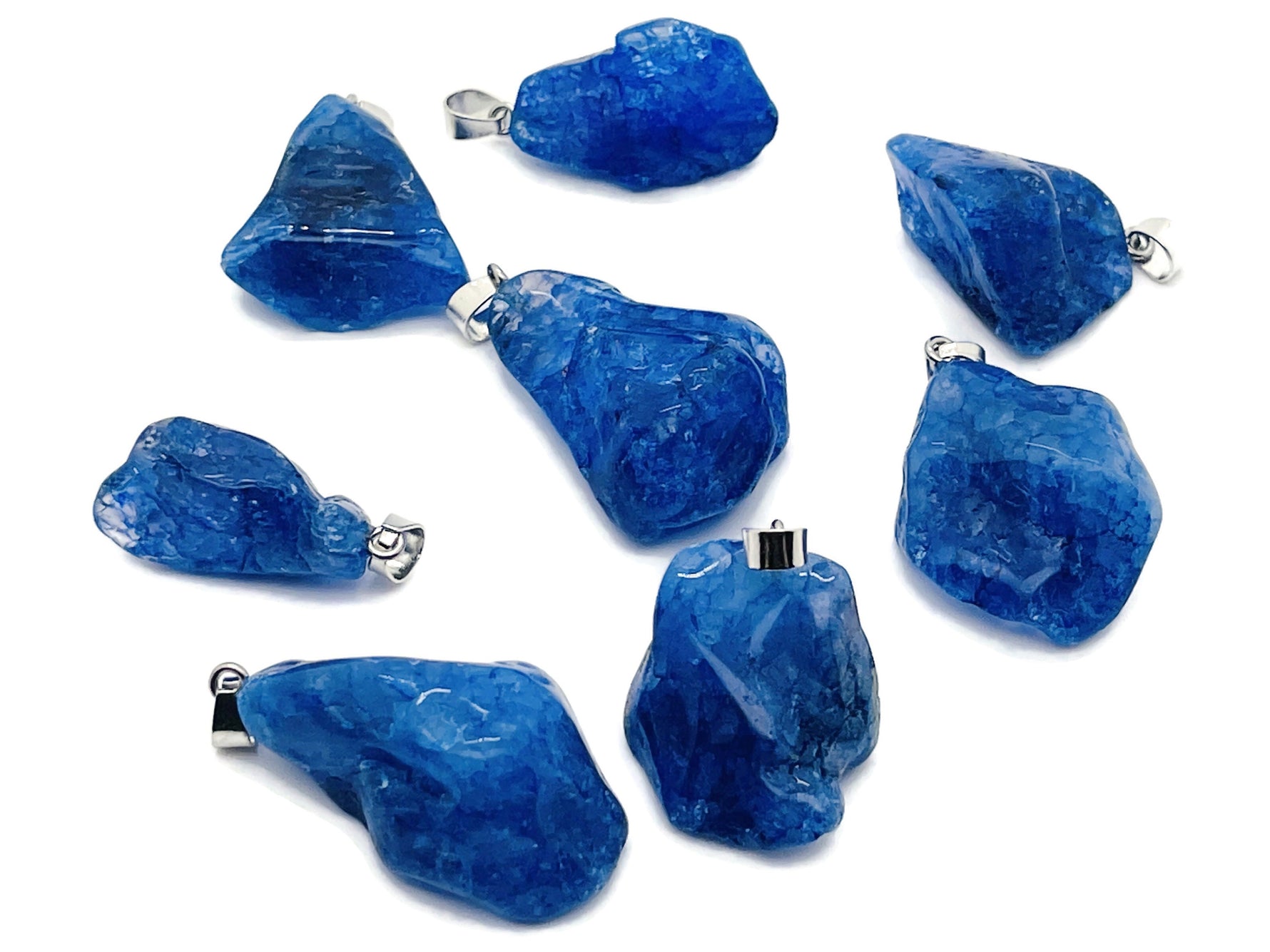 Blue agate crystal pendant from GemstoneGO featuring a polished loose stone with natural banding and healing properties.