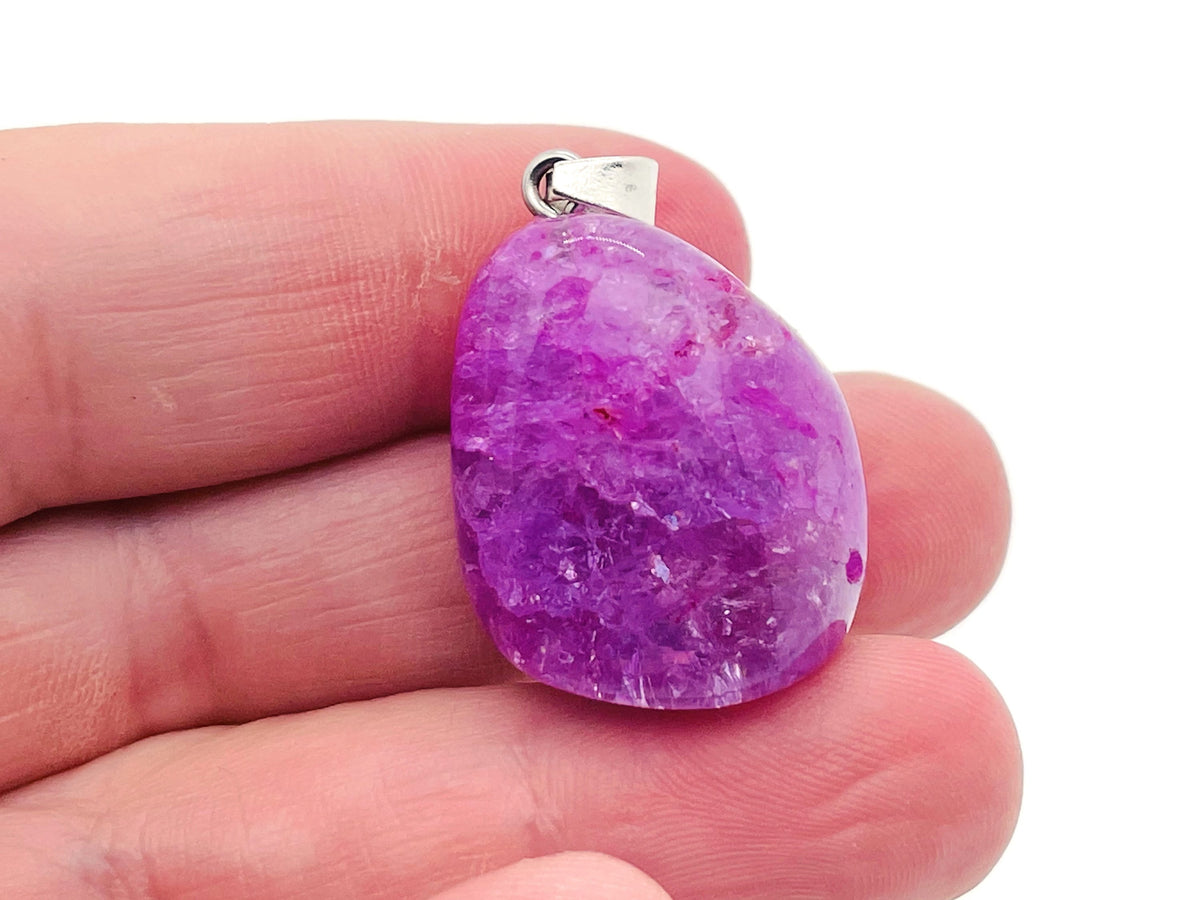 Lilac agate crystal pendant with silver setting, showcasing a polished loose stone ideal for Reiki and gemstone jewelry.