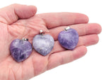 Lepidolite heart-shaped crystal pendant from GemstoneGO, showcasing a smooth, polished healing Reiki gemstone.