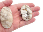 Flower Agate palm gemstone spa stone with cherry blossom patterns, showcasing vibrant pink and white floral details.