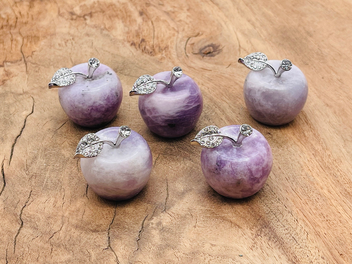 Lepidolite apple-shaped crystal carving from GemstoneGO, 30mm, showcasing purple mineral with smooth polished surface.
