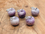 Lepidolite apple-shaped crystal carving from GemstoneGO, 30mm, showcasing purple mineral with smooth polished surface.