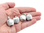 Mini Howlite Apple Crystal pendant from GemstoneGO featuring a polished white gemstone with a silver bail attachment.