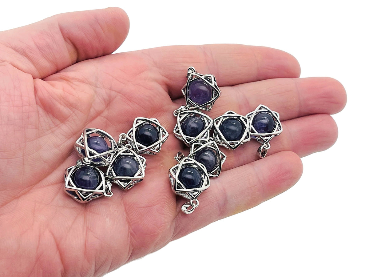 Amethyst crystal pendant jewelry from GemstoneGO featuring a polished purple amethyst stone on a silver chain.