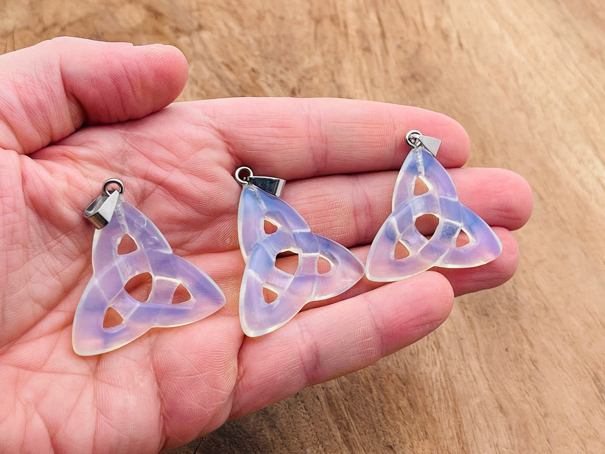 Opalite Celtic Knot crystal pendant with Trinity Crystals, featuring intricate Celtic design and polished gemstone on a silver chain.