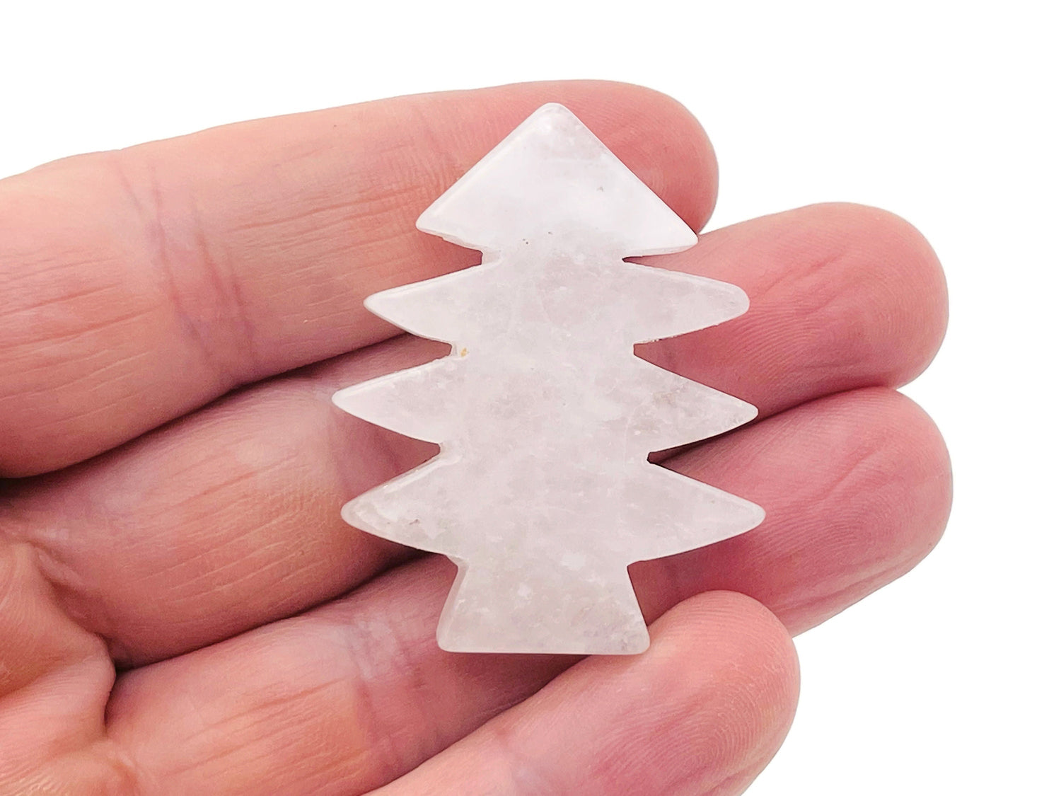 Handmade clear quartz pine tree carving gemstone, detailed tree sculpture on a smooth stone from GemstoneGO.