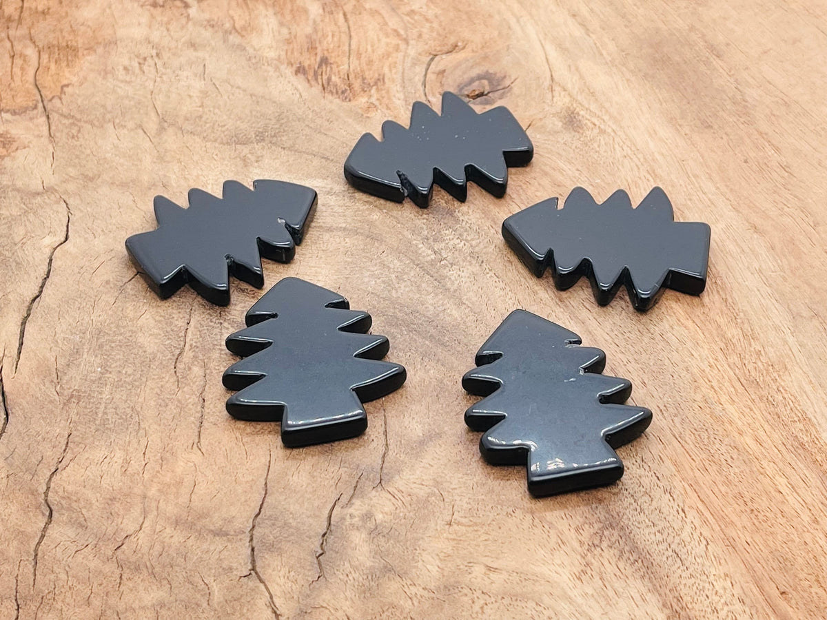 Handmade obsidian pine tree carving gemstone with detailed tree design, created by GemstoneGO.