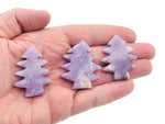 Handmade Lepidolite pine tree carving gemstone from GemstoneGO, showcasing detailed purple-green stone with natural tree design.
