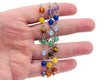 Colorful crystal chakra bracelet with seven stones from GemstoneGO, featuring a variety of polished gemstone beads.