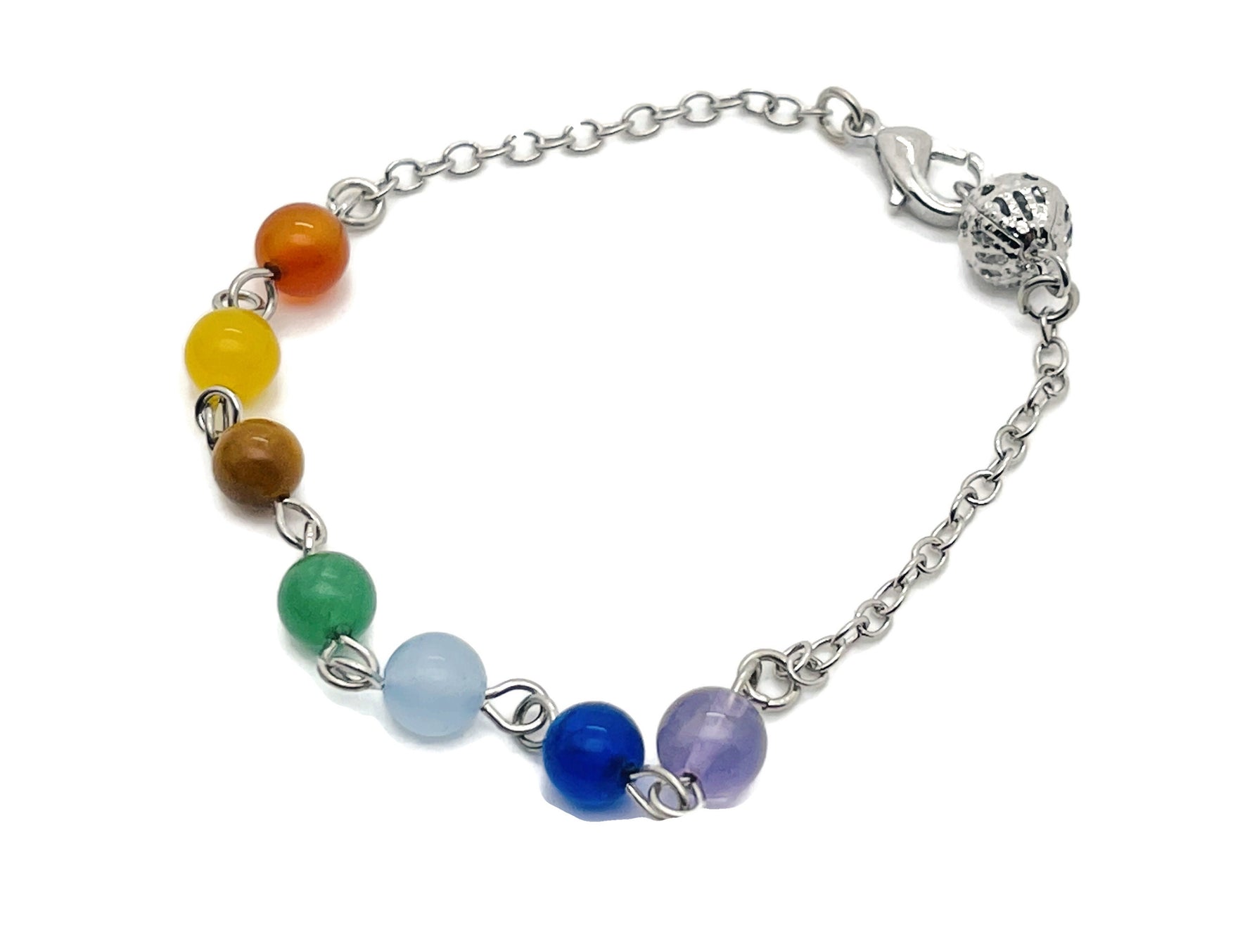 Crystal chakra bracelet with seven stones from GemstoneGO, featuring colorful polished gemstone beads on an elastic band.
