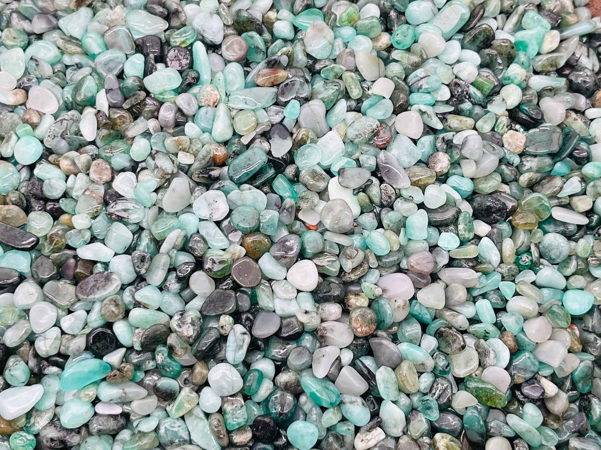 Semi-tumbled emerald crystal chips from GemstoneGO, 2-6mm bulk gemstone for jewelry or crafts in vibrant green color.