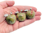 Unakite apple-shaped crystal carving from GemstoneGO, 30mm, showcasing vibrant green and pink mineral details.