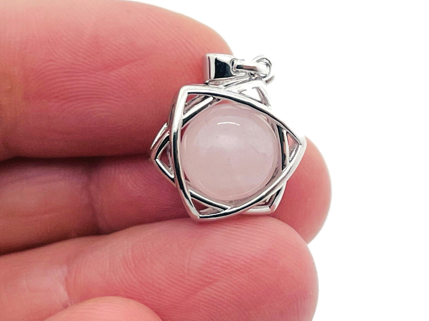 Rose quartz crystal pendant necklace from GemstoneGO, featuring a polished pink gemstone on a delicate chain.