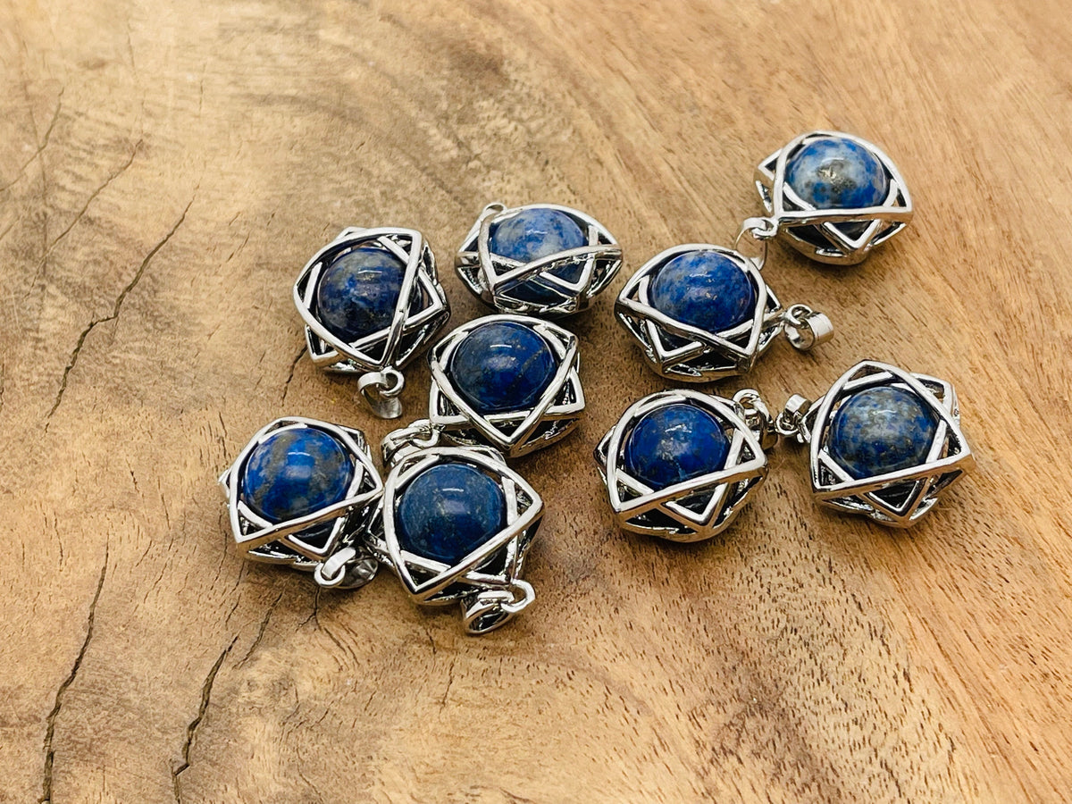 Lapis Lazuli crystal pendant jewelry by GemstoneGO, featuring a deep blue gemstone with gold flecks on a silver chain.