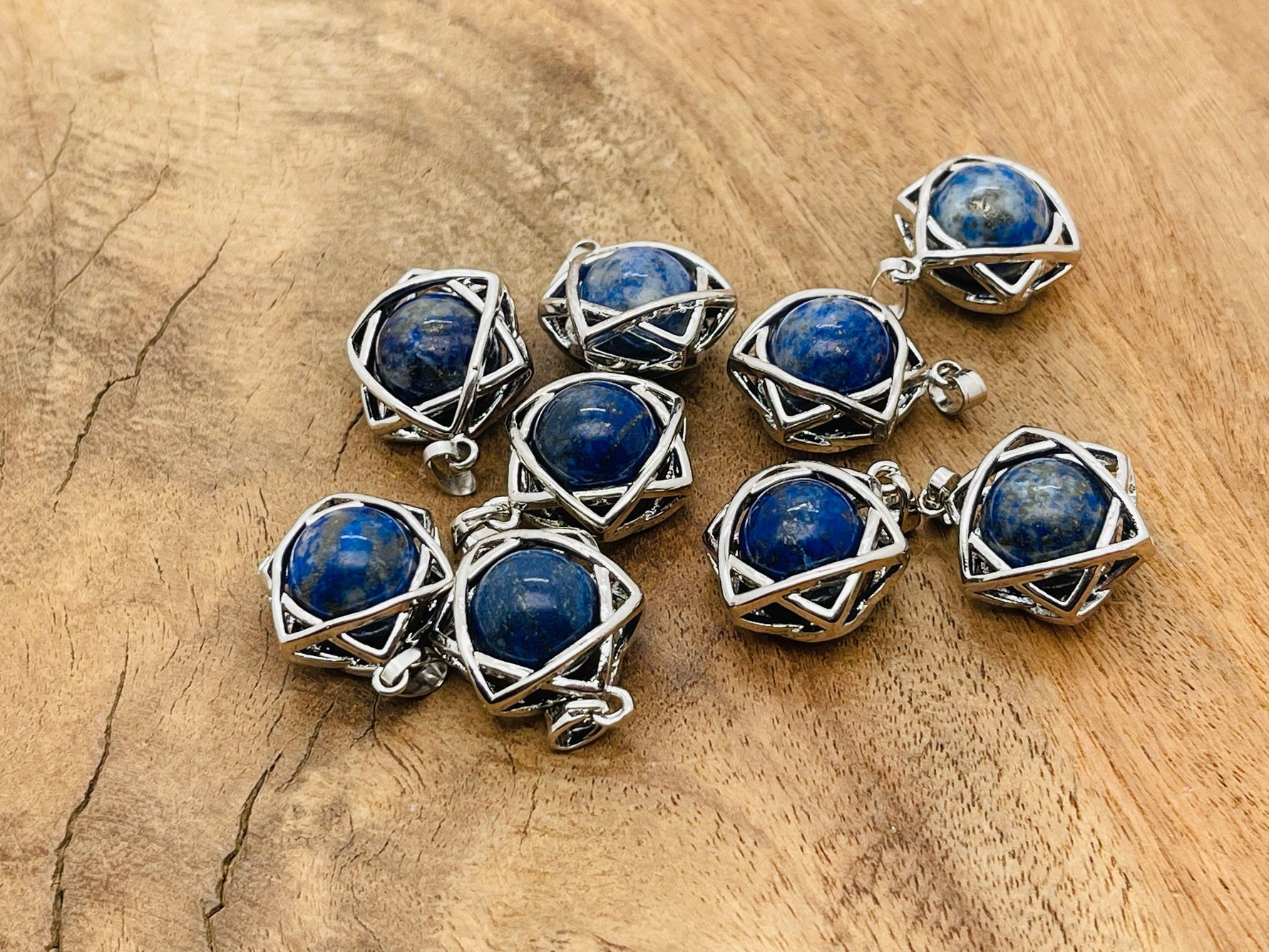 Lapis Lazuli crystal pendant jewelry by GemstoneGO, featuring a deep blue gemstone with gold flecks on a silver chain.