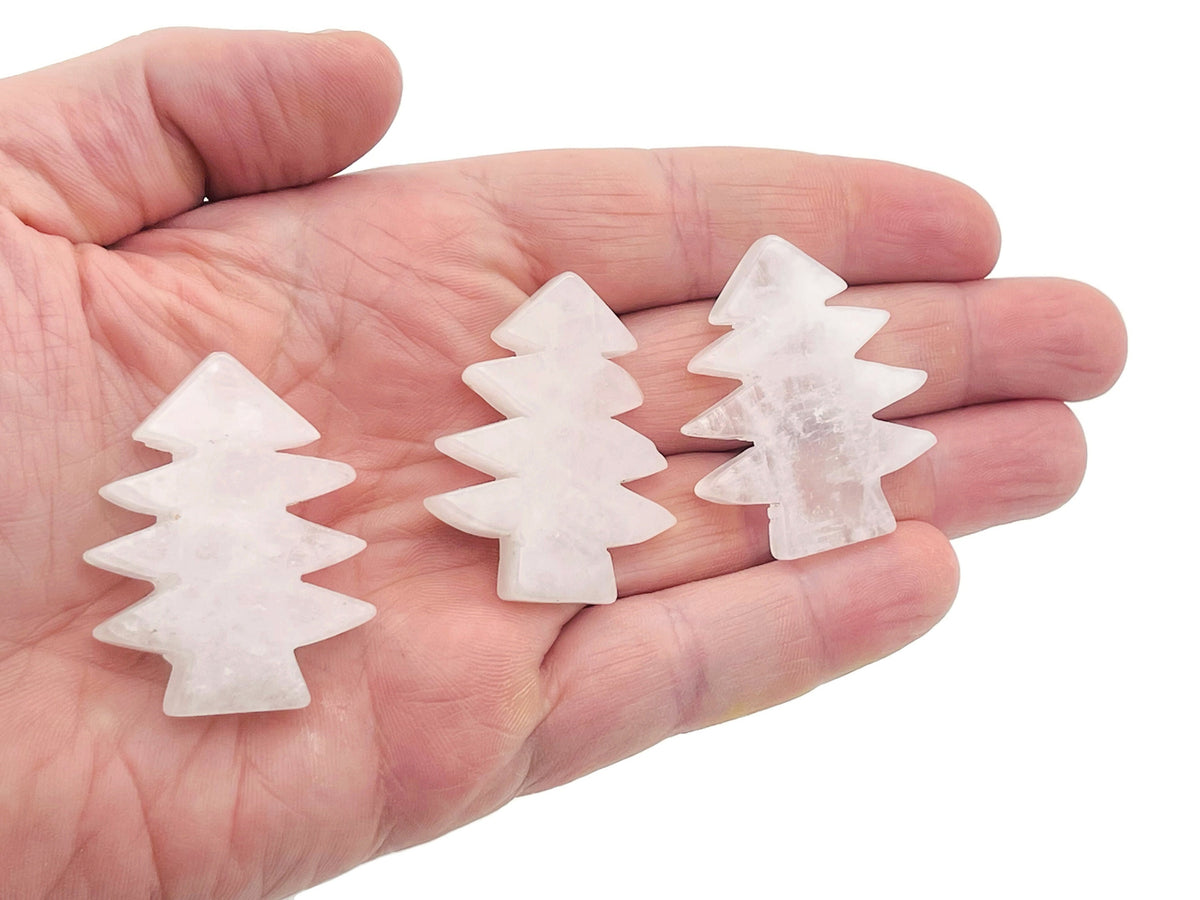Handmade clear quartz pine tree gemstone carving, showcasing detailed natural stone sculpture of a pine tree.