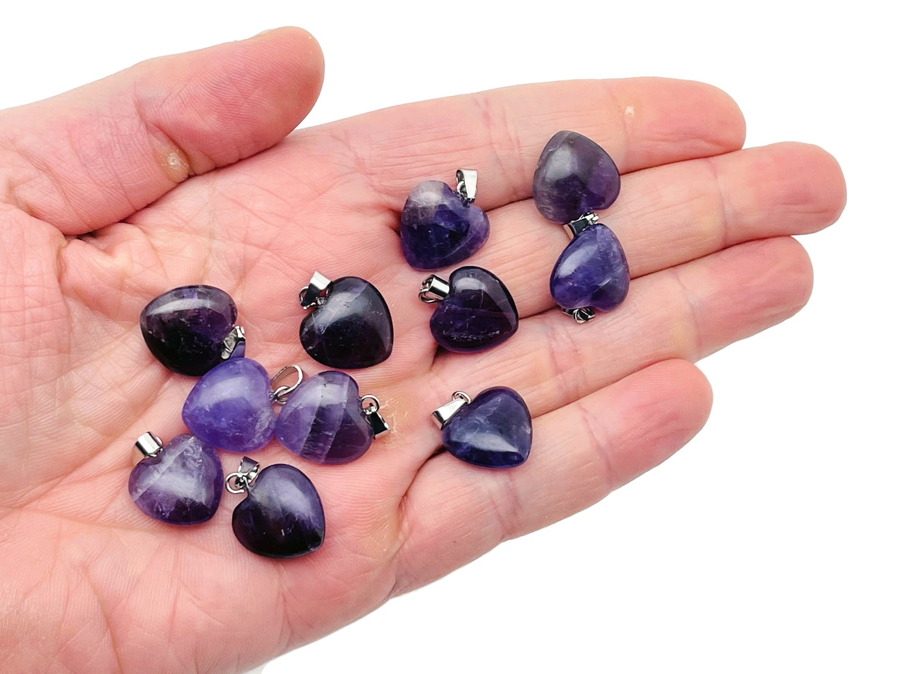 Amethyst heart-shaped pendant with a mini crystal design from GemstoneGO, showcasing the detailed purple gemstone and silver setting.