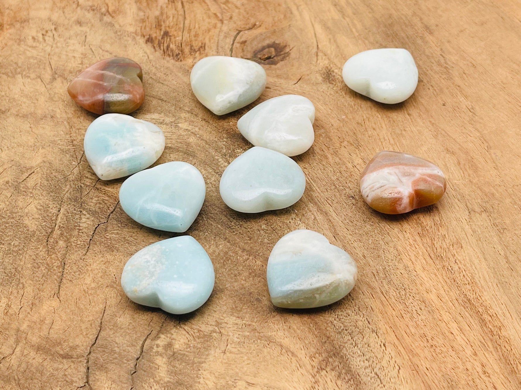 Amazonite heart-shaped gemstone, 25mm, from GemstoneGO featuring smooth, polished blue-green mineral with natural patterns.