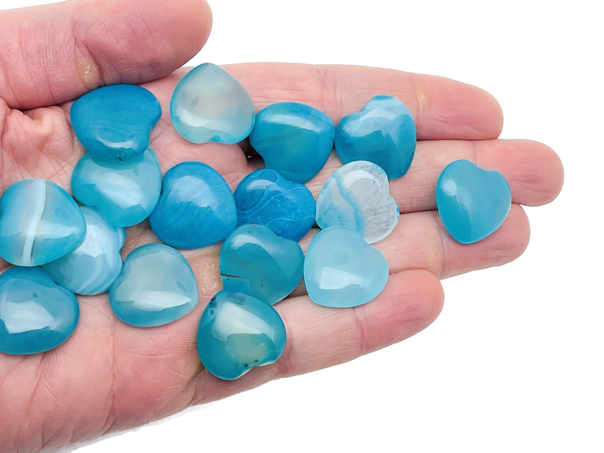 Blue agate heart-shaped gemstone pendant, 20x20x6mm, with natural banding and smooth polished surface, from GemstoneGO.