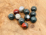 20mm African Bloodstone sphere gemstone from GemstoneGO, featuring deep green and red mineral patterns in a polished crystal ball.
