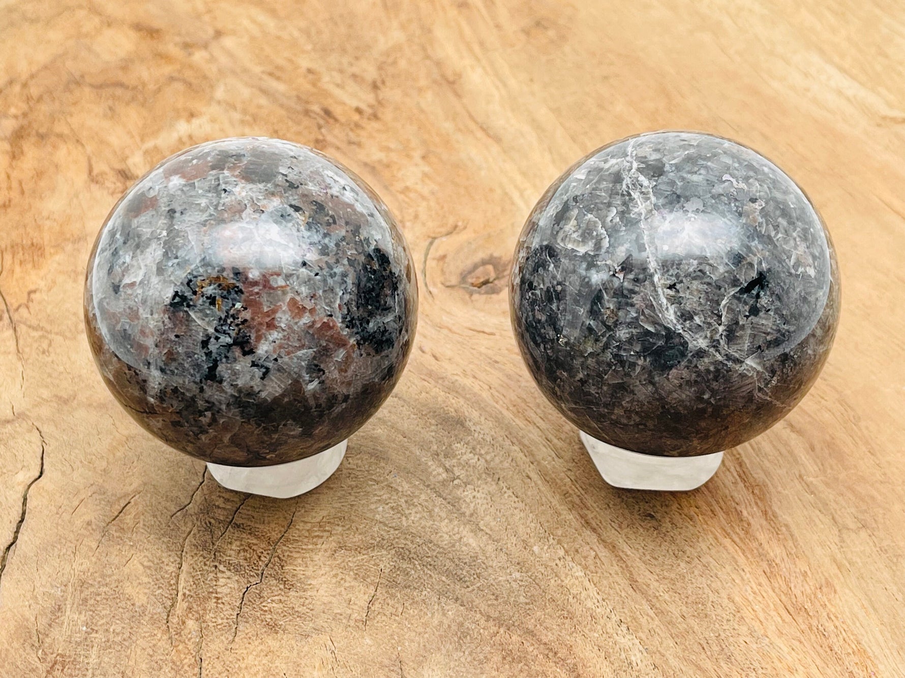 Yooperlite sphere gemstone featuring fluorescent sodalite, 55-60mm crystal ball showcasing vibrant glow under UV light.