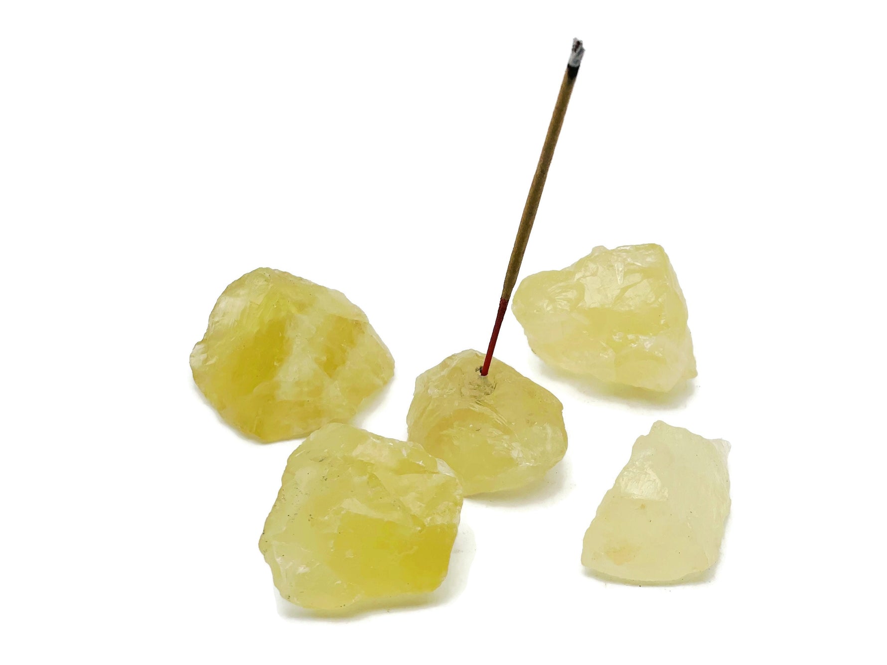 Handmade citrine rough crystal incense holder with carved design, perfect for holding incense sticks and enhancing meditation spaces.